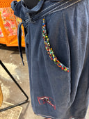 Denim Colored Linen with tie belt, customized details contrasting plackets and red buttons, clustered bead-lined pocket