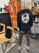Classic meets punk with this Peter Pan collar Jacket, painted skulls sleeves and back, red accent and buttons