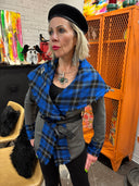 Stricking wrap jacket with blue tartan collar and vegan leather trim and belt, large safety pin brocher